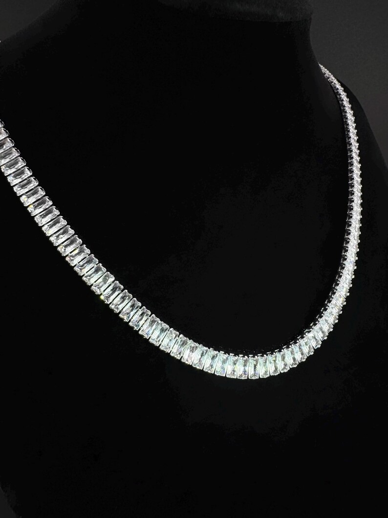 Baguette cut diamond tennis line jewelry showing individually set stones and continuous link construction