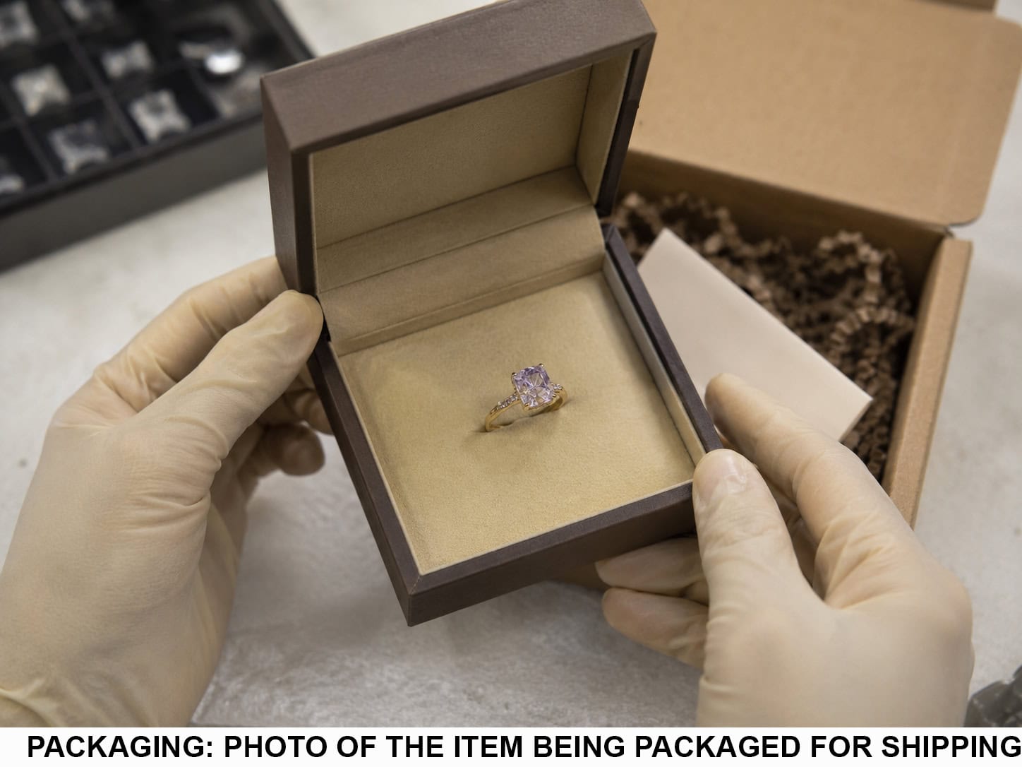Finished Bluequeen diamond ring being placed into its presentation box